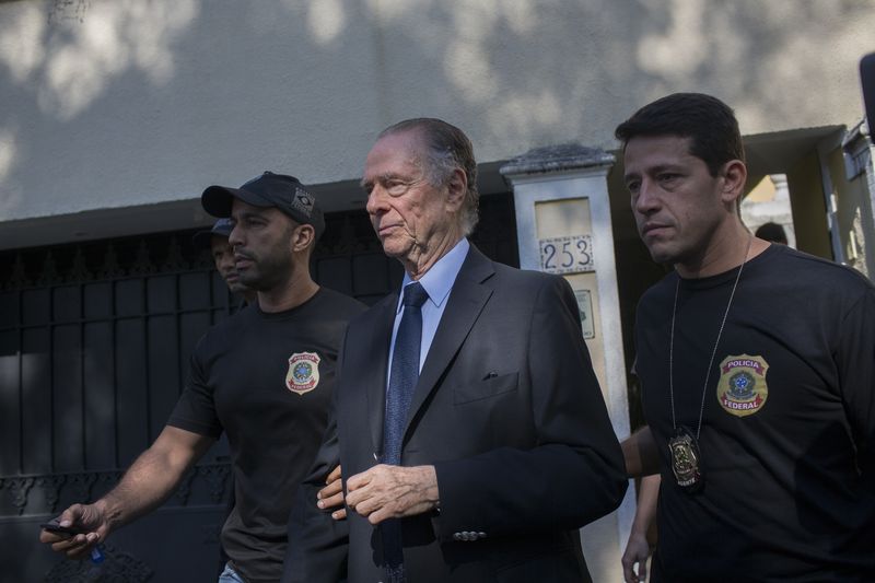 Brazilu00e2u20acu2122s Olympic Committee chief Carlos Nuzman (centre) is escorted from his home by federal police in Rio de Janeiro October 5, 2017. u00e2u20acu201d Reuters pic