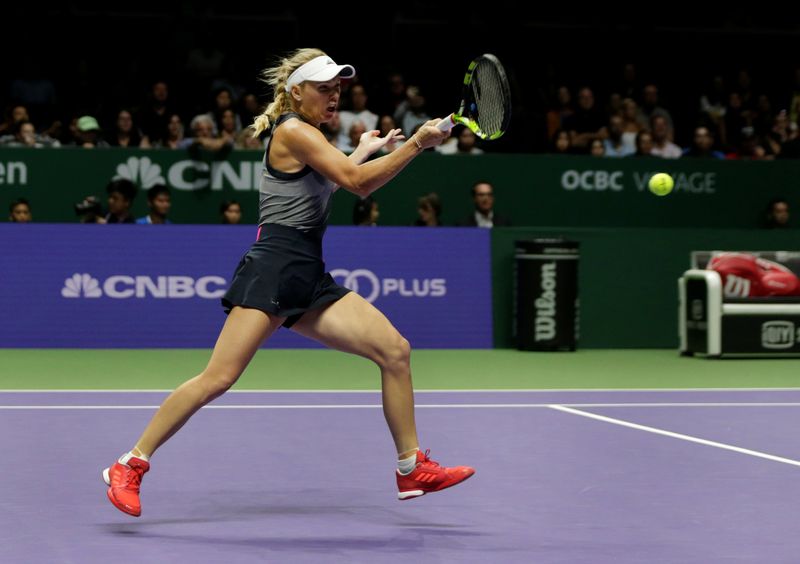 Denmarku00e2u20acu2122s Caroline Wozniacki in action during her group stage match with Romaniau00e2u20acu2122s Simona Halep during the WTA Tour Finals in the Singapore Indoor Stadium, October 25, 2017. u00e2u20acu201d Reuters pic