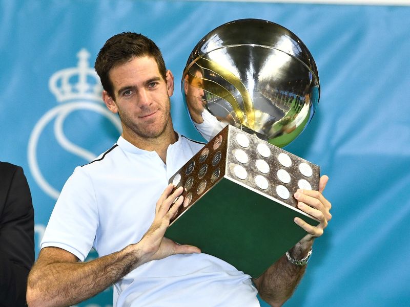 Juan Martin Del Potro of Argentina pose with a trophy after his win against Grigor Dimitrov of Bulgaria. u00e2u20acu201d Reuters pic