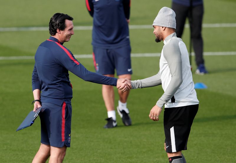 Paris Saint-Germainu00e2u20acu2122s Layvin Kurzawa shakes hands with coach Unai Emery during training at the Centre Ooredoo Camp, Saint Germain-En-Laye, Paris, September 26, 2017. u00e2u20acu201d Reuters pic