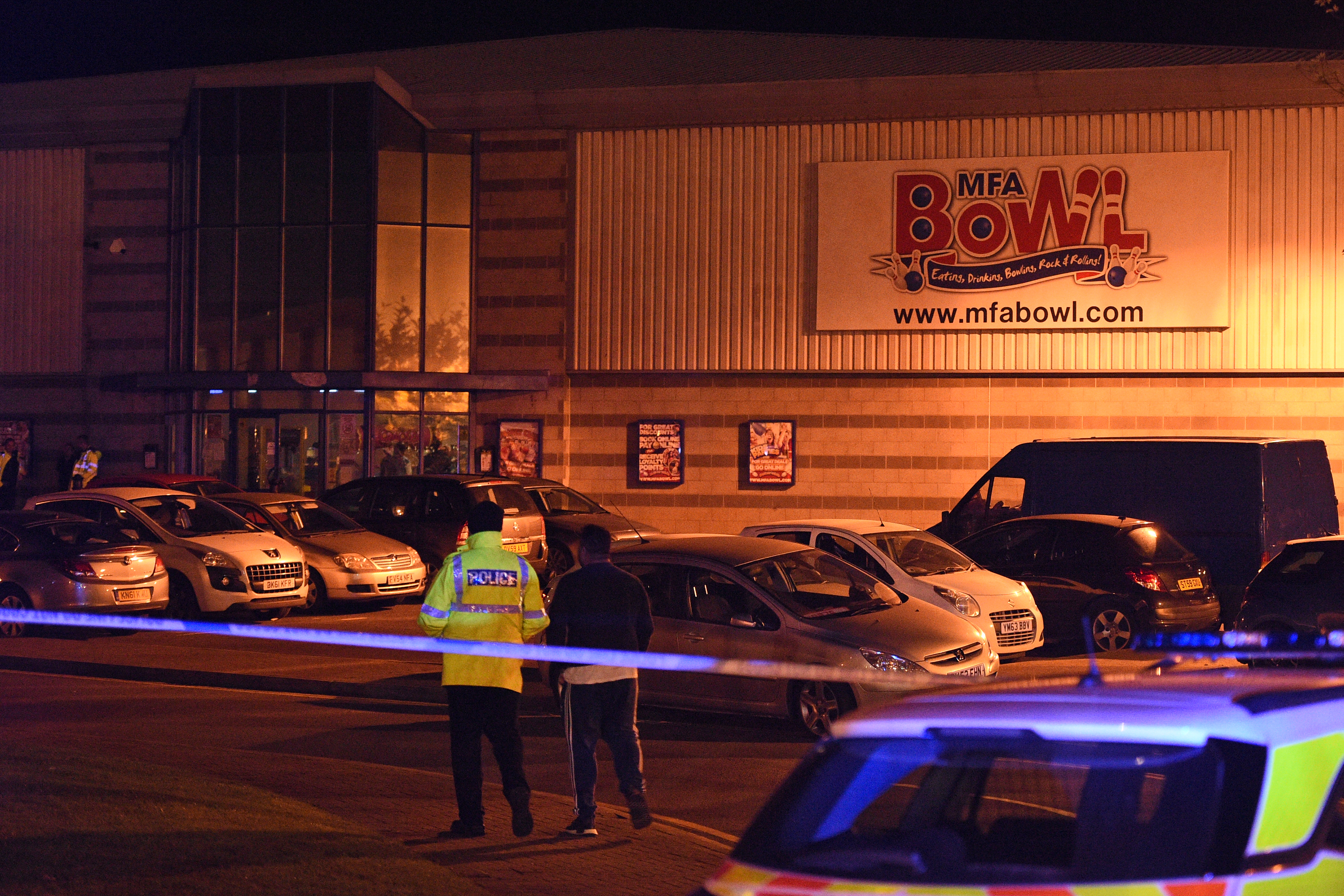 Police stand guard inside a cordon near the MFA Bowl at The Bermuda leisure park in Nuneaton, central England, on October 22, 2017. u00e2u20acu201d AFP pic 