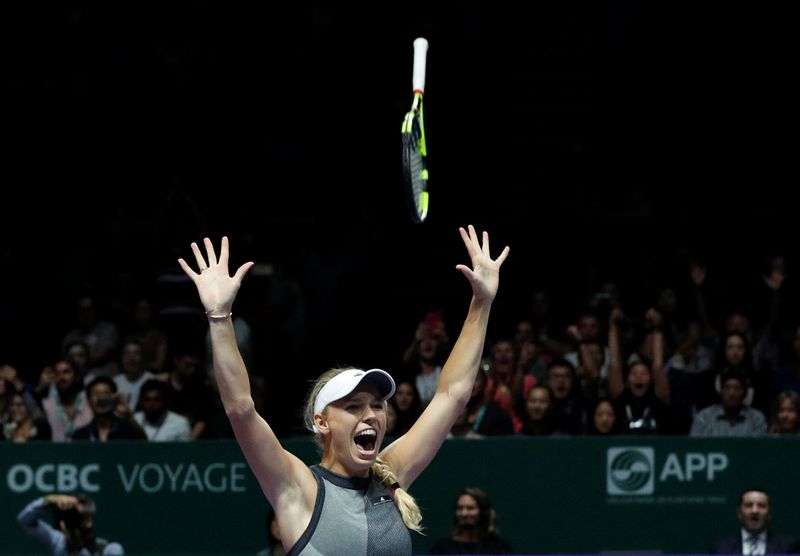 Denmarku00e2u20acu2122s Caroline Wozniacki celebrates after winning the final against USAu00e2u20acu2122s Venus Williams at the WTA Tour Finals in Singapore Indoor Stadium, Singapore, October 29, 2017. u00e2u20acu201d Reuters pic