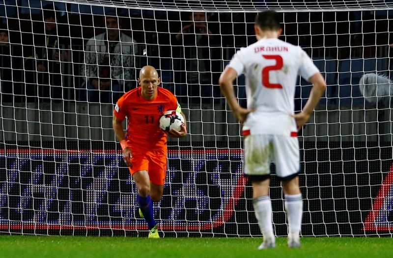 Netherlandsu00e2u20acu2122 Arjen Robben celebrates after scoring the second goal from the penalty spot. u00e2u20acu2022 Reuters pic