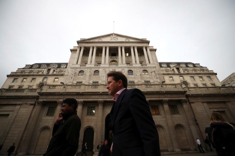 File picture shows people walking past the Bank of England in London, October 17, 2017. u00e2u20acu201d Reuters pic
