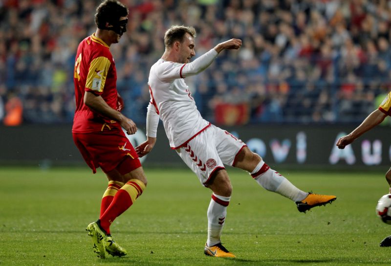 Denmark's Christian Eriksen scores the first goal against Montenegro. u00e2u20acu2022 Reuters pic