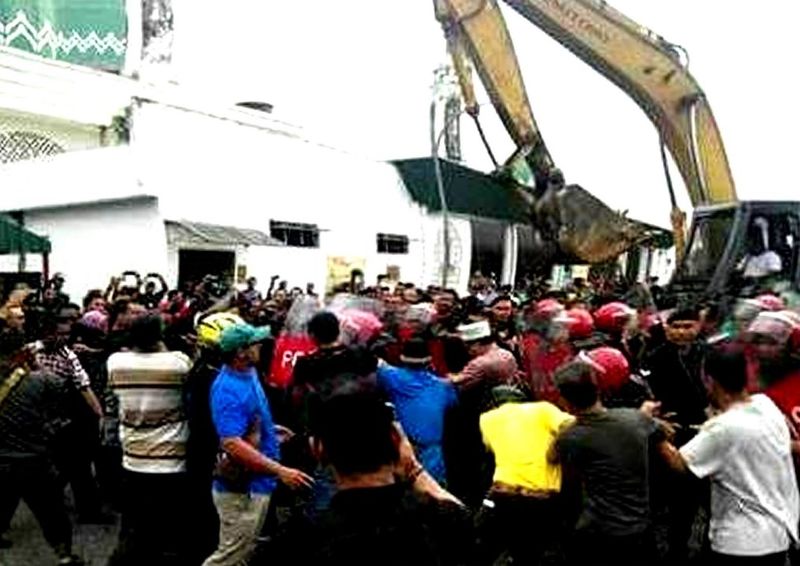 Nine people, including Parti Sosialis Malaysia (PSM) secretary-general A. Sivarajan were arrested for protesting against the demolition of homes and shops near the Sultan Abdul Aziz Airport in Subang . u00e2u20acu201d Picture courtesy of Facebook/Sosialis