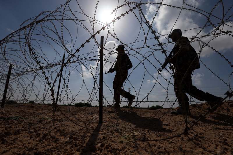 Members of Palestinian security forces loyal to Hamas patrol on the border with Egypt in Rafah, in the southern Gaza Strip October 8, 2017. u00e2u20acu201d Reuters pic 