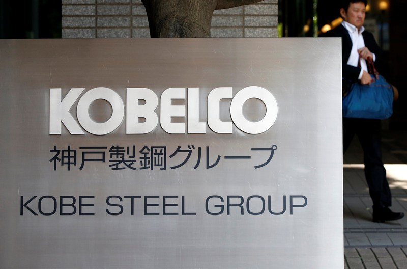 A man walks past the signboard of Kobe Steel at the group's Tokyo headquarters in Tokyo October 10, 2017. u00e2u20acu201d Reuters picn