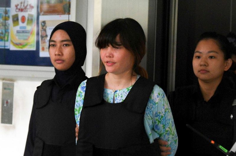 Vietnamese suspect Doan Thi Huong, 28, wearing a bulletproof vest while being led out of the Shah Alam High Court, October 3, 2017, during the second day of the Kim Jong-nam murder trial. u00e2u20acu201d Bernama pic