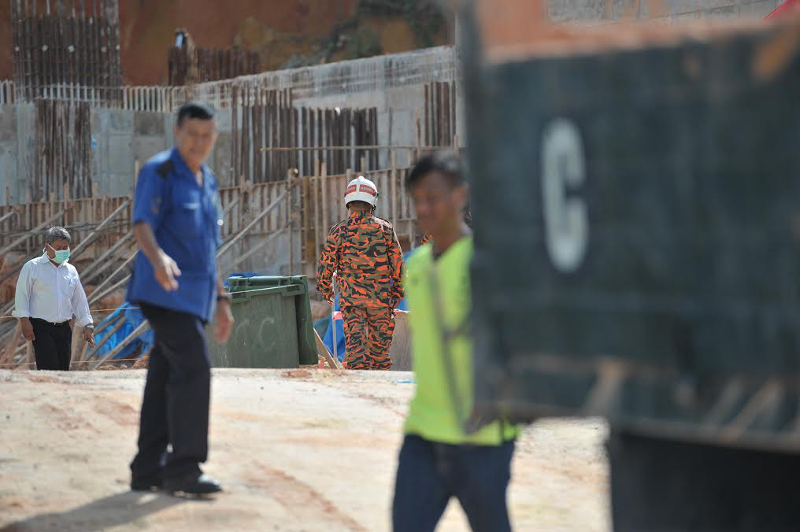 Fire and rescue officers inspecting the site of the landslide in Tanjung Bungah, Penang October 21, 2017.u00e2u20acu201d Picture by KE Ooi