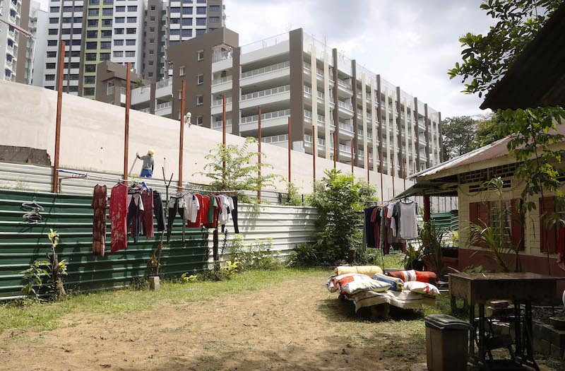 New HDB developments seen next to a kampung house in in Kampung Buangkok. — TODAY pic