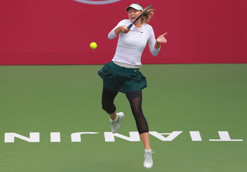 Maria Sharapova of Russia hits a return against Stefanie Voegele of Switzerland during their womenu00e2u20acu2122s singles quarter-final match at the WTA Tianjin Open tennis tournament in Tianjin on October 13, 2017. u00e2u20acu201d AFP pic