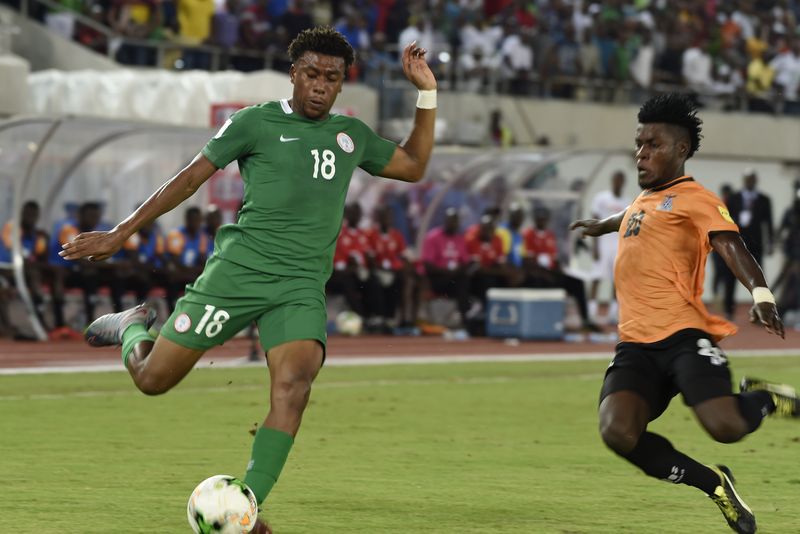 Nigeriau00e2u20acu2122s forward Alex Iwobi (left) fights for the ball with Zambiau00e2u20acu2122s midfielder Simon Silwimba during their Fifa World Cup 2018 qualifying match in the southern Nigerian city of Uyo, on October 7, 2017. u00e2u20acu201d AFP pic