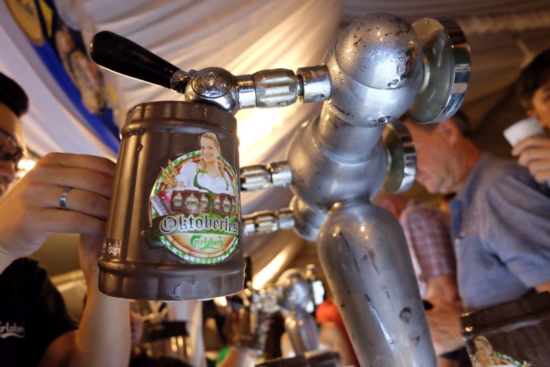 A bartender pours a mug of beer during Oktoberfest celebrations in George Town October 13, 2017. u00e2u20acu2022 Picture by KE Ooi