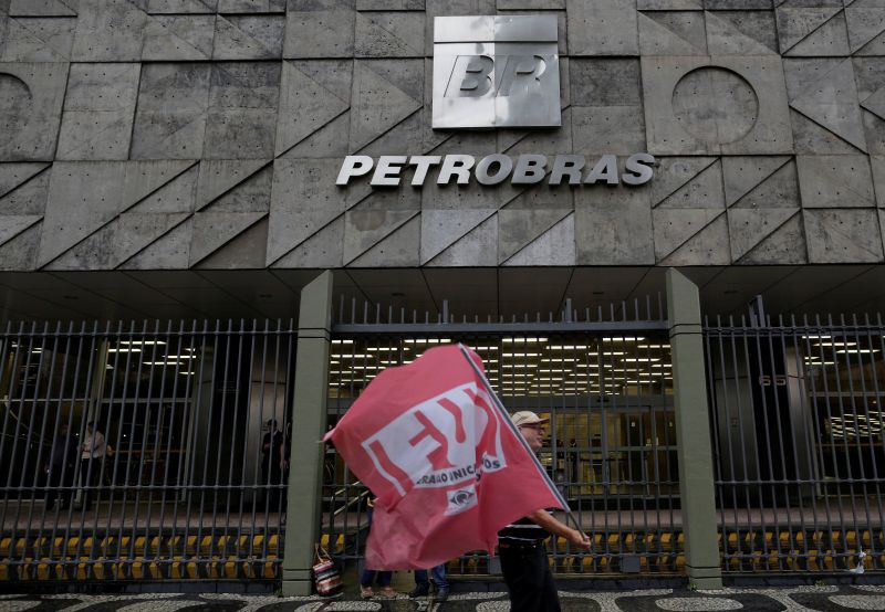 A man walks in front the headquarters of Brazil's state-run Petrobras oil company, during a protest against the privatisation of state owned companies in Rio de Janeiro October 4, 2017. u00e2u20acu201d Reuters pic