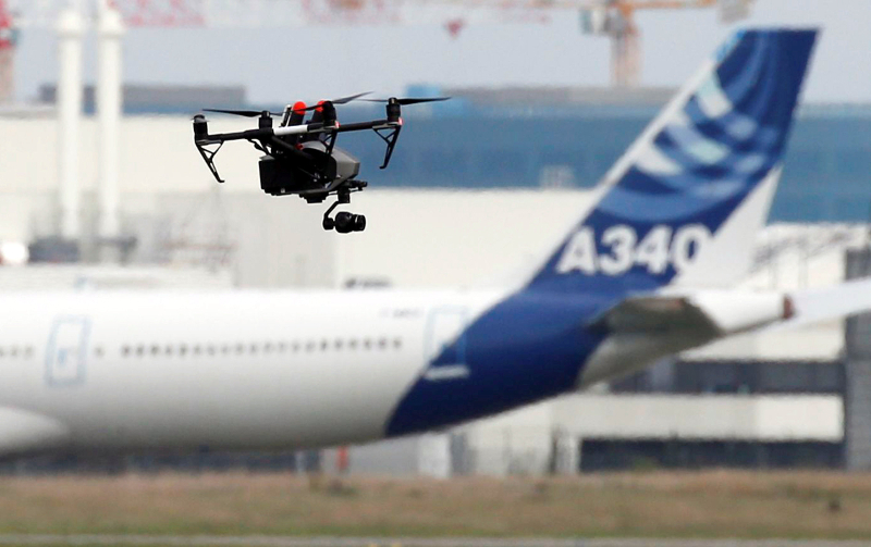 A drone flies near an Airbus A340 aircraft in Colomiers near Toulouse October 19, 2017. u00e2u20acu201d Reuters pic
