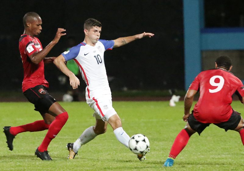 United Statesu00e2u20acu2122 Christian Pulisic and Trinidadu00e2u20acu2122s Kevan George and Shahdon Winchester in action during the 2018 World Cup Qualifications at Ato Boldon Stadium, Couva October 10, 2017. u00e2u20acu201d Reuters pic