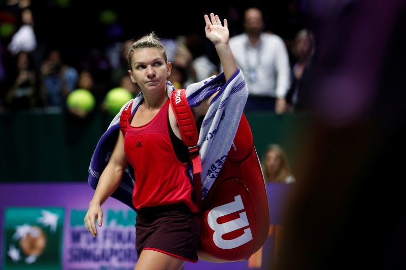 Romania's Simona Halep waves to the crowd after her group stage match against Ukraine's Elina Svitolina. u00e2u20acu2022 Reuters pic