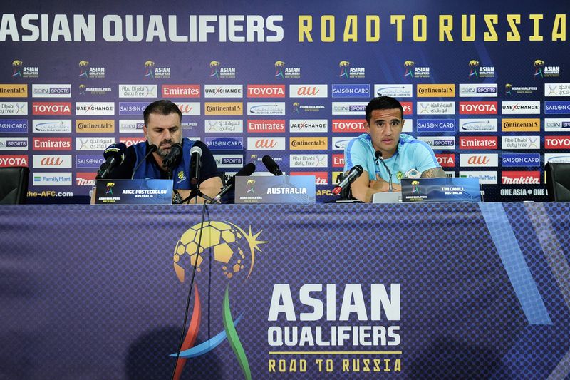 Australiau00e2u20acu2122s Tim Cahill (right) speaks beside football coach Ange Postecoglou during a press conference ahead of their 2018 World Cup qualifying match between Syria and Australia at the Hang Jebat Stadium in Malacca on October 4, 2017. u00e2u20acu201d AFP pic