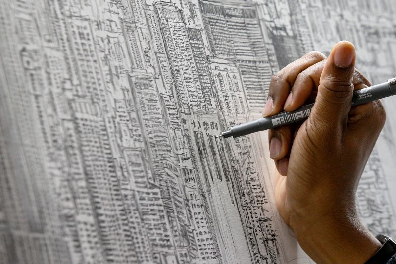 Autistic British artist Stephen Wiltshire works on his panoramic drawing of the New York skyline, after seeing the city from a helicopter, at the Empire State Building in New York City October 12, 2017. u00e2u20acu201d Reuters pic