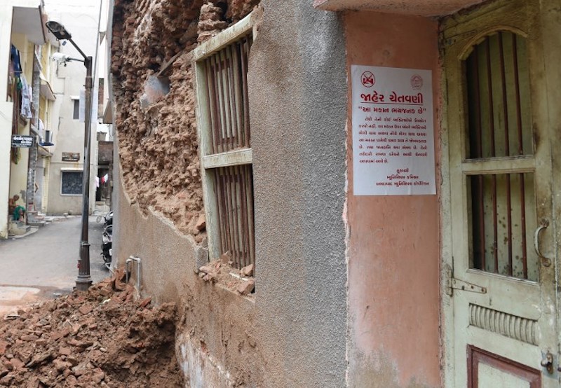 A Gujarati language warning notice related to a structurally damaged old heritage building is seen in Ahmedabad July 31, 2017. — AFP pic