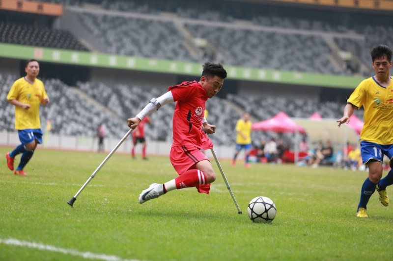 He Yiyi kicks the ball during a football match with a local team in Guangzhou province November 12, 2017. u00e2u20acu201d AFP pic