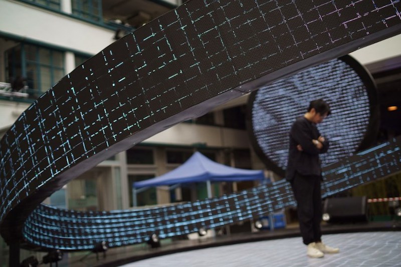 Hong Kong artist Keith Lam stands in the middle of his u00e2u20acu02dcHeliocentricu00e2u20acu2122 art installation before the opening of Lumieres Hong Kong November 23, 2017. u00e2u20acu201d AFP pic