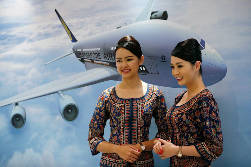 Flight attendants pose for photos at a presentation of Singapore Airlinesu00e2u20acu2122 newly launched cabin products in Singapore, November 2, 2017. u00e2u20acu201d Reuters pic