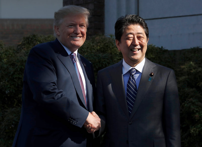 US President Donald Trump shakes hands with Japanu00e2u20acu2122s Prime Minister Shinzo Abe at Kasumigaseki Country Club in Kawagoe, north of Tokyo, Japan November 5, 2017. u00e2u20acu201d Reuters pic