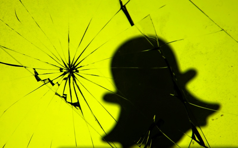 A 3D printed Snapchat logo is seen through broken glass in this illustration taken November 7, 2017. u00e2u20acu201d Reuters pic