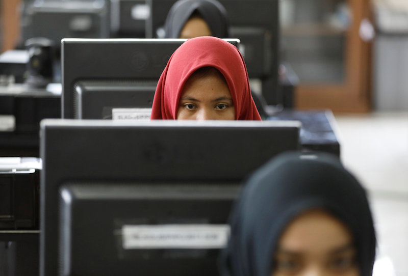 Students at a government-run Vocational Training Centre study basic computer skills in Jakarta November 10, 2017. u00e2u20acu201d Reuters pic