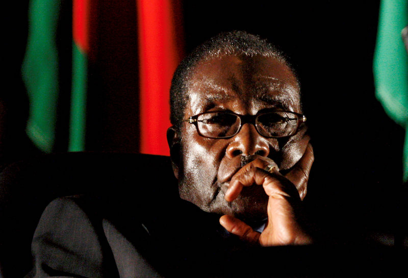 Zimbabwean President Robert Mugabe watches a video presentation during the summit of the Southern African Development Community (SADC) in Johannesburg August 17, 2008. u00e2u20acu201d Reuters pic