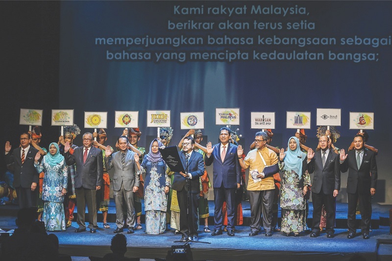 Representatives from various government departments, led by the director-general of Istana Budaya, Datuk Mohamed Juhari Shaarani (centre) pledge to fight for the national language. u00e2u20acu201d Picture by Malay Mail