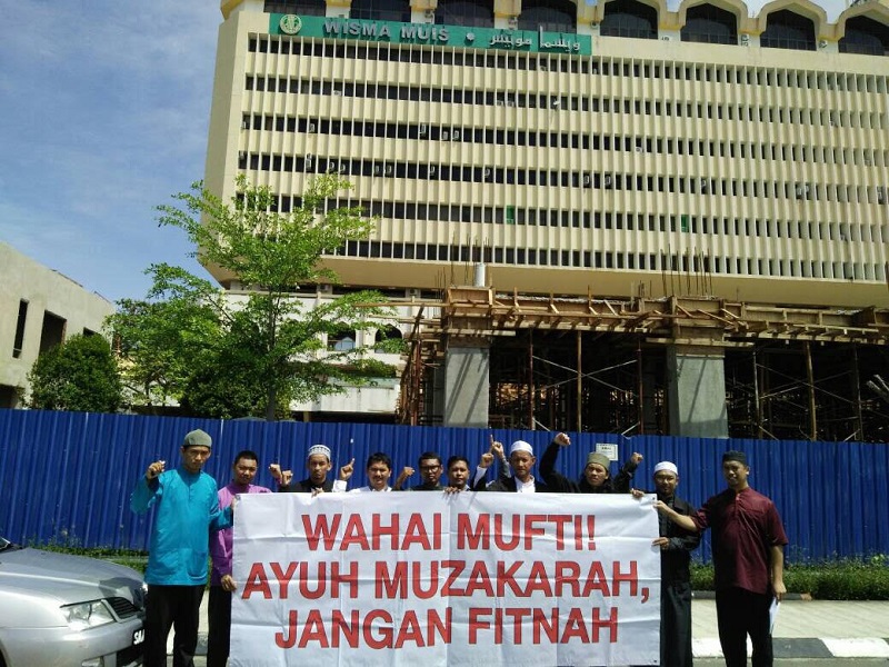 Representatives from Hizbut Tahrir Malaysia group staged a peaceful protest after handing over a memo to the state religious authorities to protest against a fatwa declaring them a deviant group. u00e2u20acu201d Picture by Julia Chan