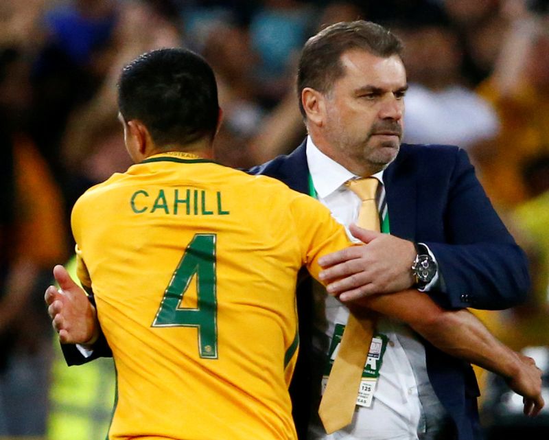 Australiau00e2u20acu2122s Tim Cahill hugs Australia coach Ange Postecoglou as he is substituted off during the game against Honduras. u00e2u20acu2022 Reuters pic