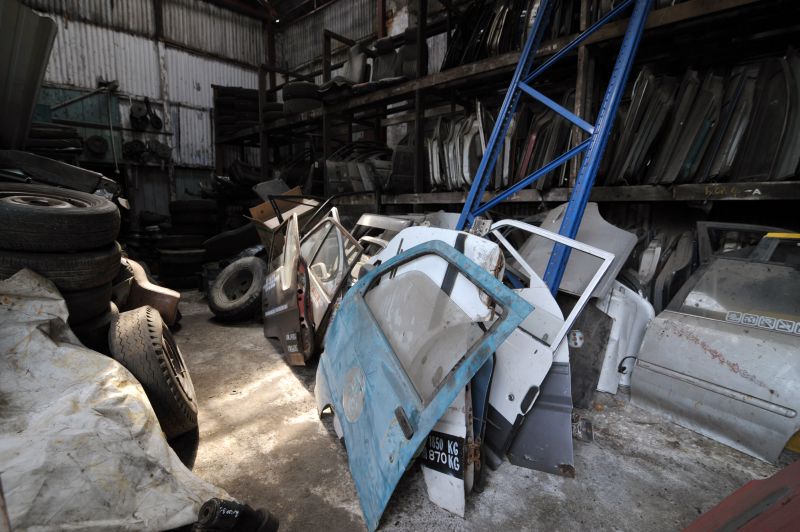 Car doors in a row at an auto shop in Jalan Kampung Gajah.
