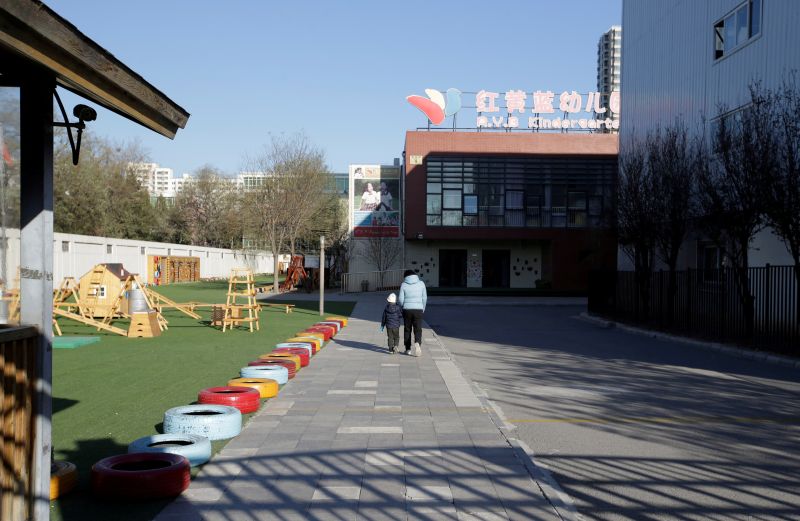 A child walks with a parent at the kindergarten run by pre-school operator RYB Education Inc being investigated by Chinau00e2u20acu2122s police, in Beijing, China November 24, 2017. u00e2u20acu201d Reuters pic