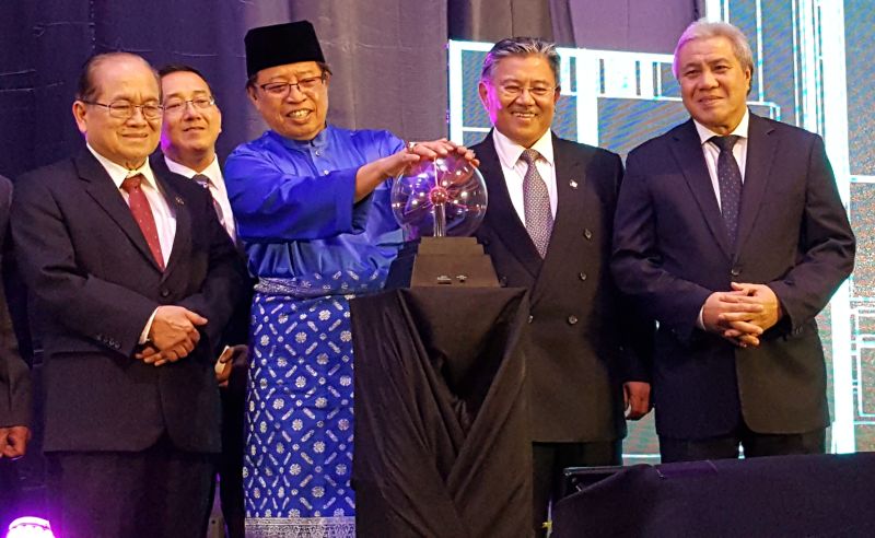 Chief Minister Datuk Patinggi Abang Johari Openg (in blue) launches the Development Bank of Sarawak (DBoS) logo, November 3, 2017. u00e2u20acu2022 Picture by Sulok Tawie