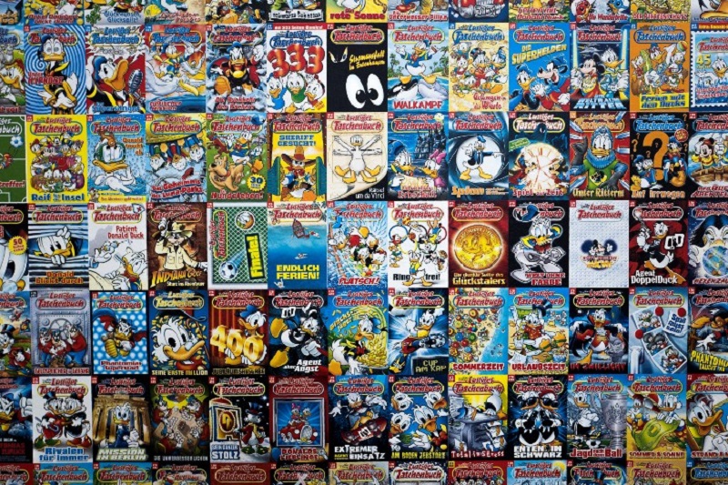 A display made up of hundreds of covers of Donald Duck pocket books, called u00e2u20acu02dcLustiges Taschenbuchu00e2u20acu2122 in German) and featuring Disney comics, is seen on November 6, 2017 at a temporary shop set up in Berlin to mark the comic booku00e2u20acu2122s 50th anniversary. u00e2u20ac