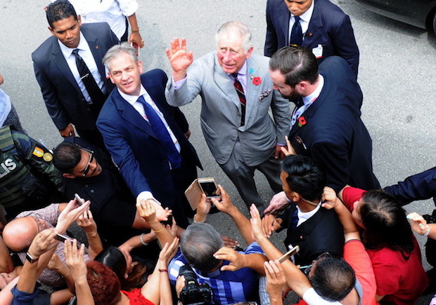 Prince Charles waves to the crowd during a visit to Seven Terraces in Stewart Lane, George Town, November 7, 2017. u00e2u20acu201d Bernama pic