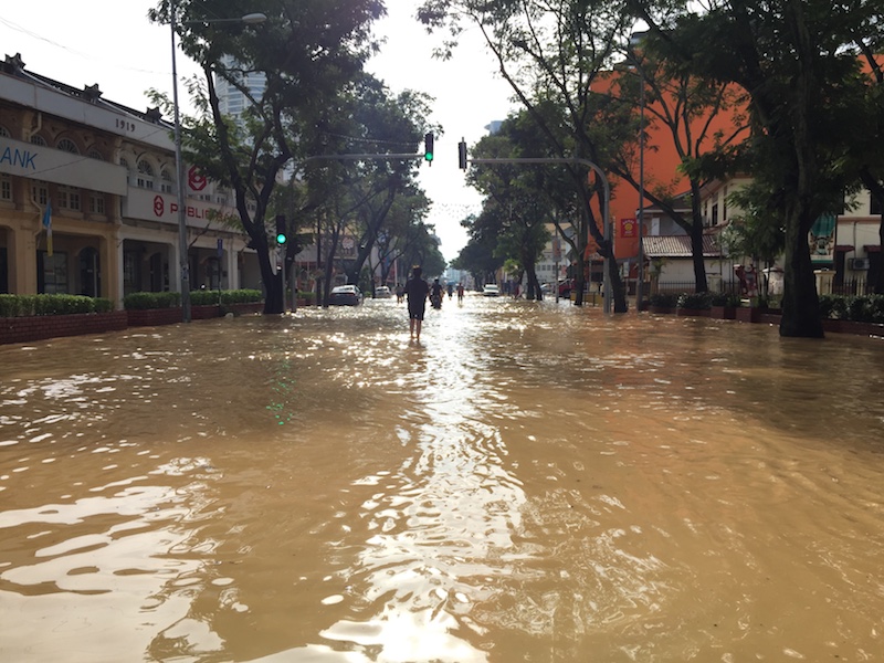 People wade through ankle-deep water along Macalister Road in George Town November 5, 2017. u00e2u20acu201d Picture by KE Ooi