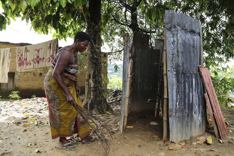 A woman stands in front of her toilets, close to her home in the Kindele district of Kinshasa November 17, 2017. u00e2u20acu201d AFP pic