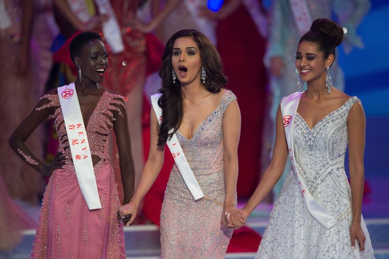 Miss India Manushi Chhilar (centre) reacts as she wins the 67th Miss World contest final next to France Aurore Andru00c3u00a9e Raphau00c3u00ablle Kichenin (right) and Miss Kenya Magline Jeruto (left) in Sanya, on the tropical Chinese island of Hainan on November 18, 2017