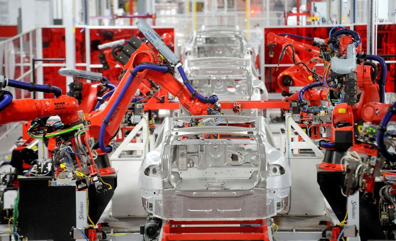 Robotic arms assemble Tesla's Model S sedans at the company's factory in Fremont, California. u00e2u20acu2022 Reuters pic
