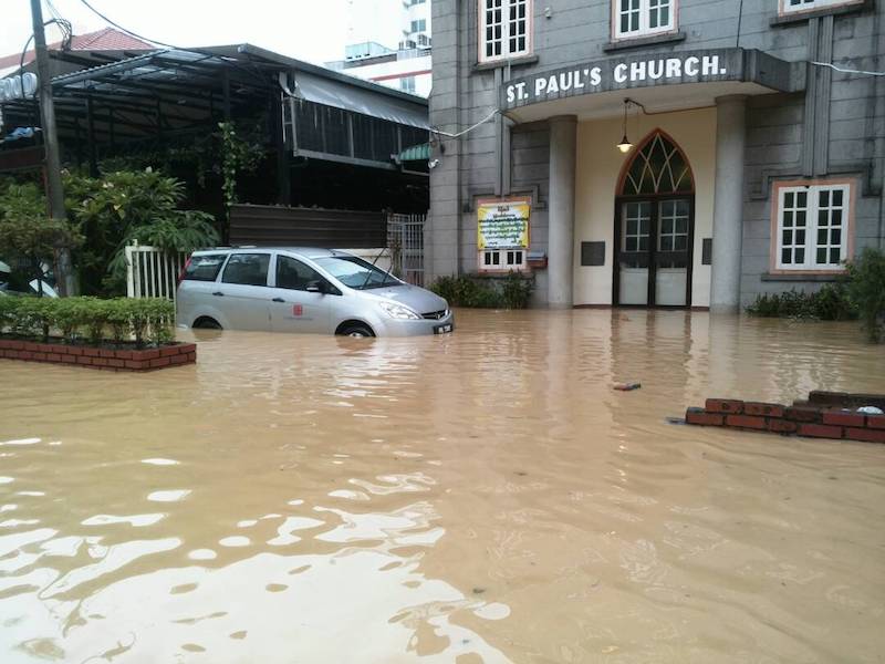 A partially submerged car is seen outside the Anglican St Paulu00e2u20acu2122s Church on Macalister Road in George Town November 5, 2017. u00e2u20acu201d Picture courtesy of Ang Joo Tat