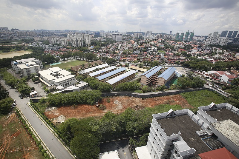 Seen here in the foreground is Tiara Faber’s roof followed by the project site which is only separated from the three schools by a single stretch of road.
