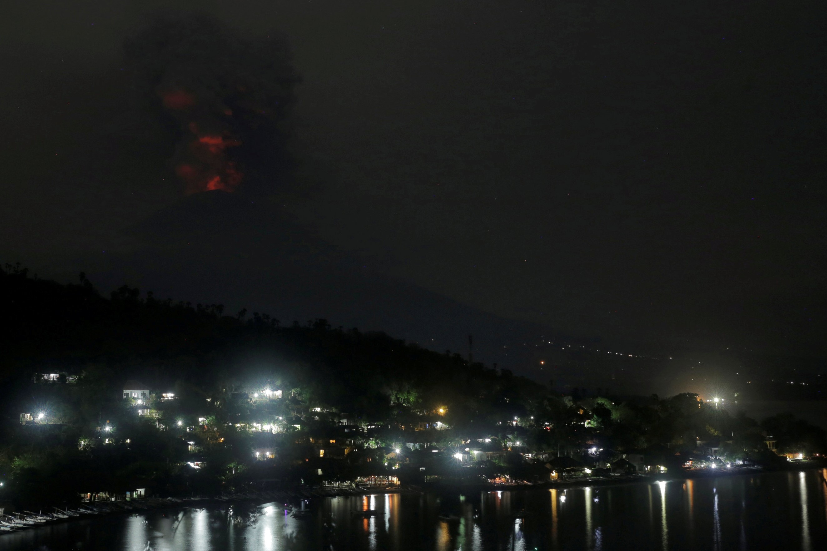 Glowing light of hot lava reflected on the volcanic ash during the eruption of Mount Agung is seen from Amed in Karangasem, Bali resort island, Indonesia, November 27, 2017. u00e2u20acu201d Reuters  pic 