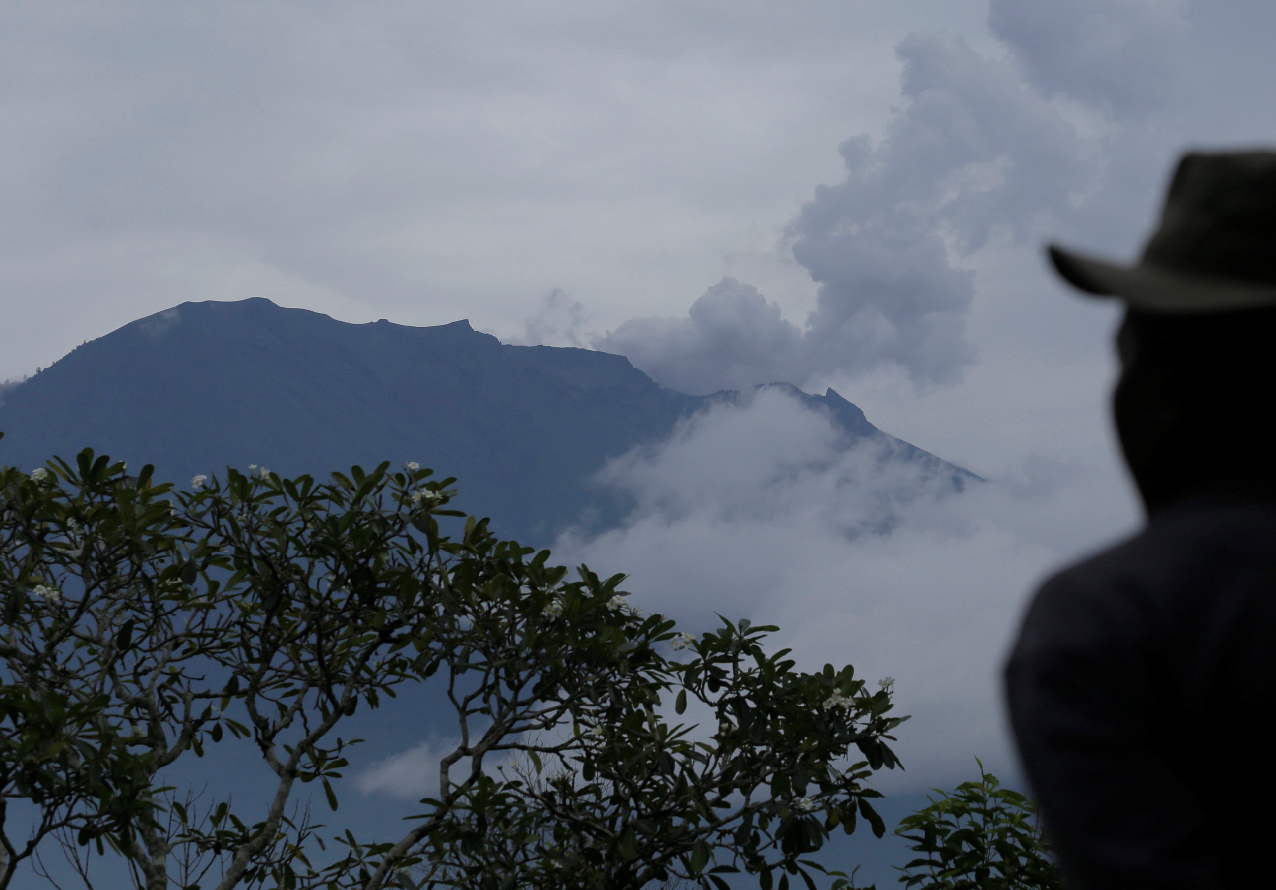 A villager looks at Mount Agung following a phreatic eruption in Rendang Village, Karangasem, Bali, Indonesia November 22, 2017. u00e2u20acu201d AFP pic