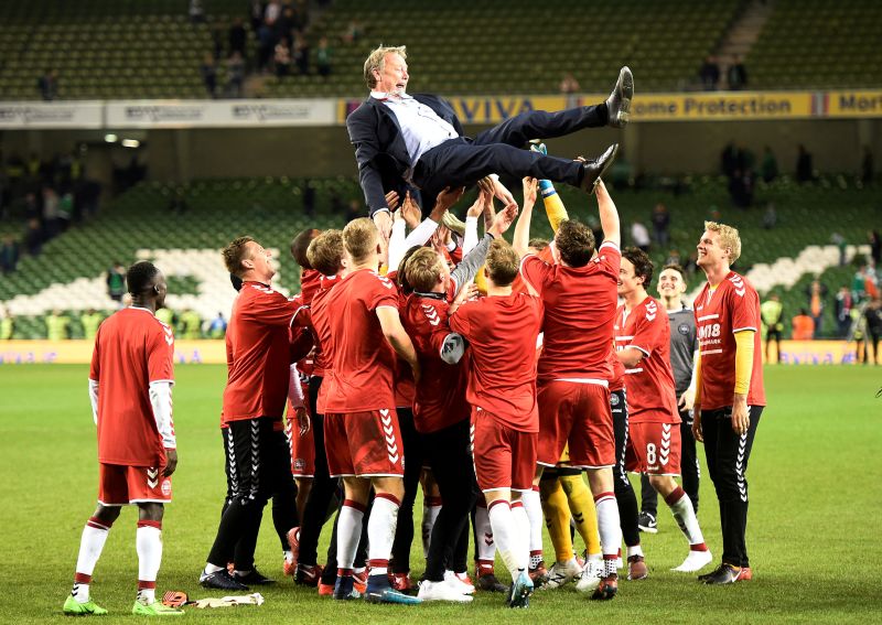 Denmark players celebrate with coach Age Hareide after the match against Republic of Ireland in Dublin November 15, 2017. u00e2u20acu2022 Reuters pic
