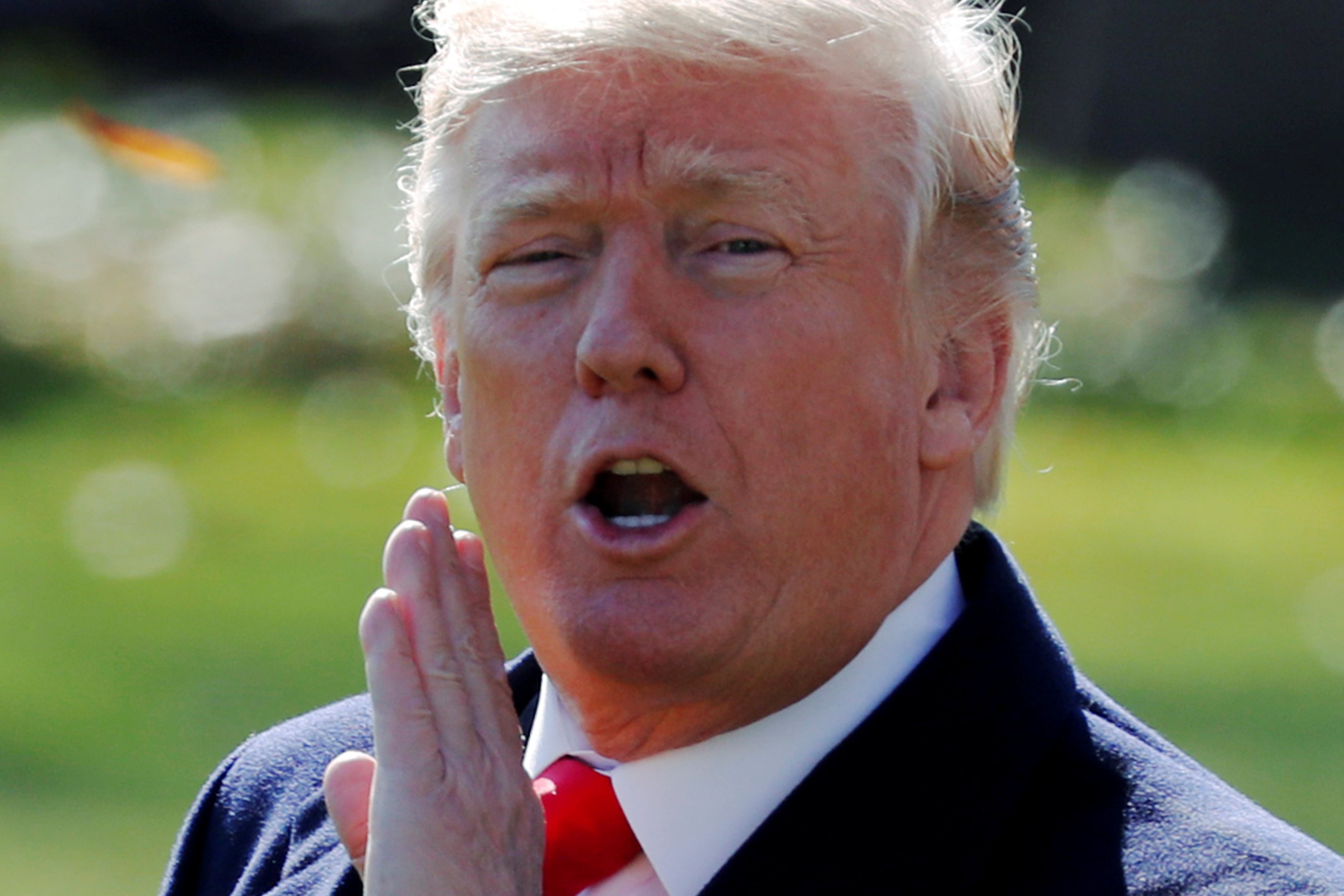 US President Donald Trump shouts to reporters as he departs for travel to Missouri from the White House in Washington, November 29, 2017. u00e2u20acu201d Reuters pic